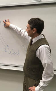 Philosophy lecturer Brett Yardley teaching in the classroom